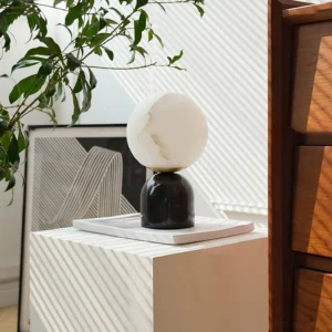 Billy table lamp in modern bedroom setting with green plants and art decor three-quarter view