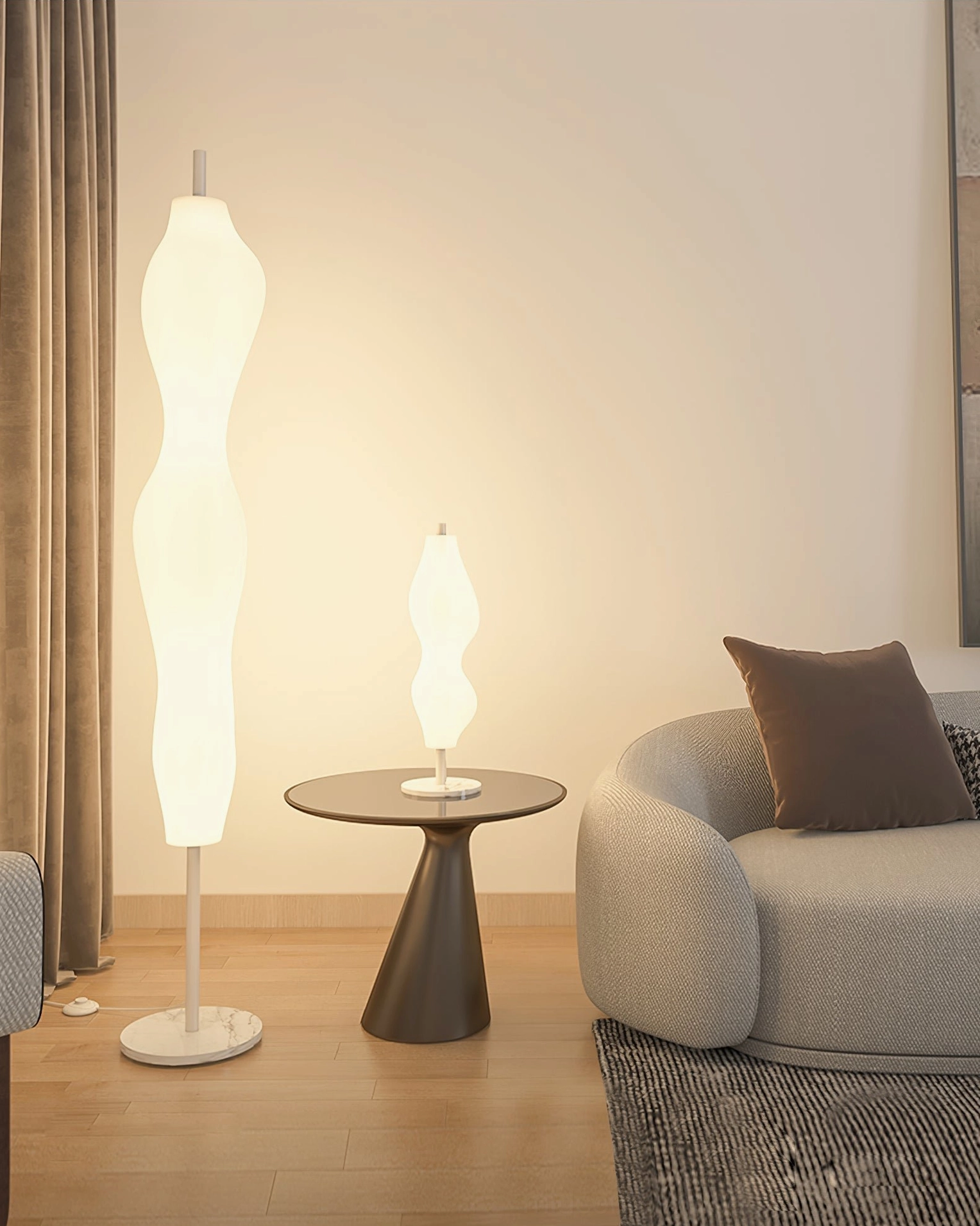 White organic floor lamp detail showing rotationally molded diffuser and metal base construction