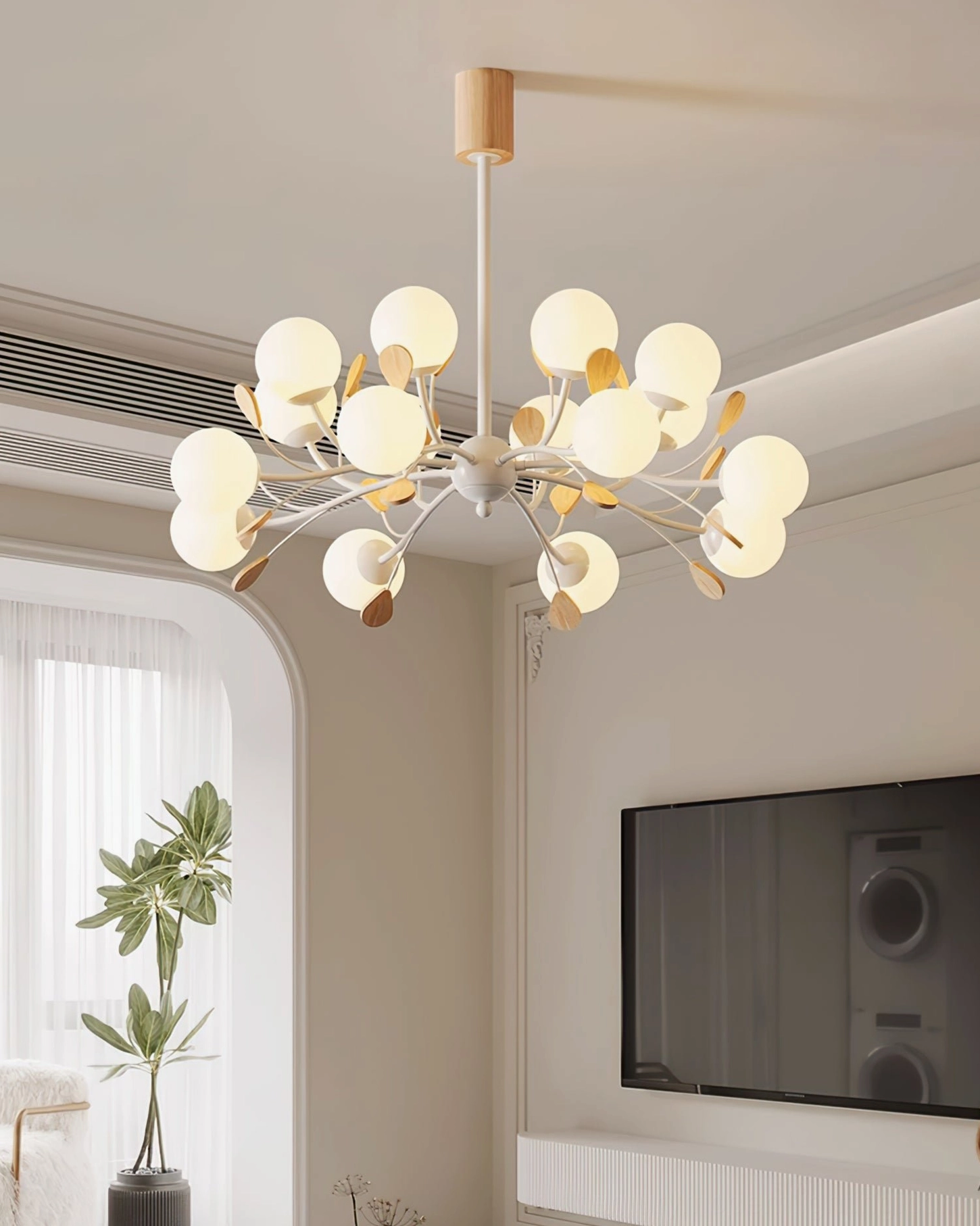 Birdle Branch Chandelier in contemporary TV lounge with minimalist warm interior design and arched window