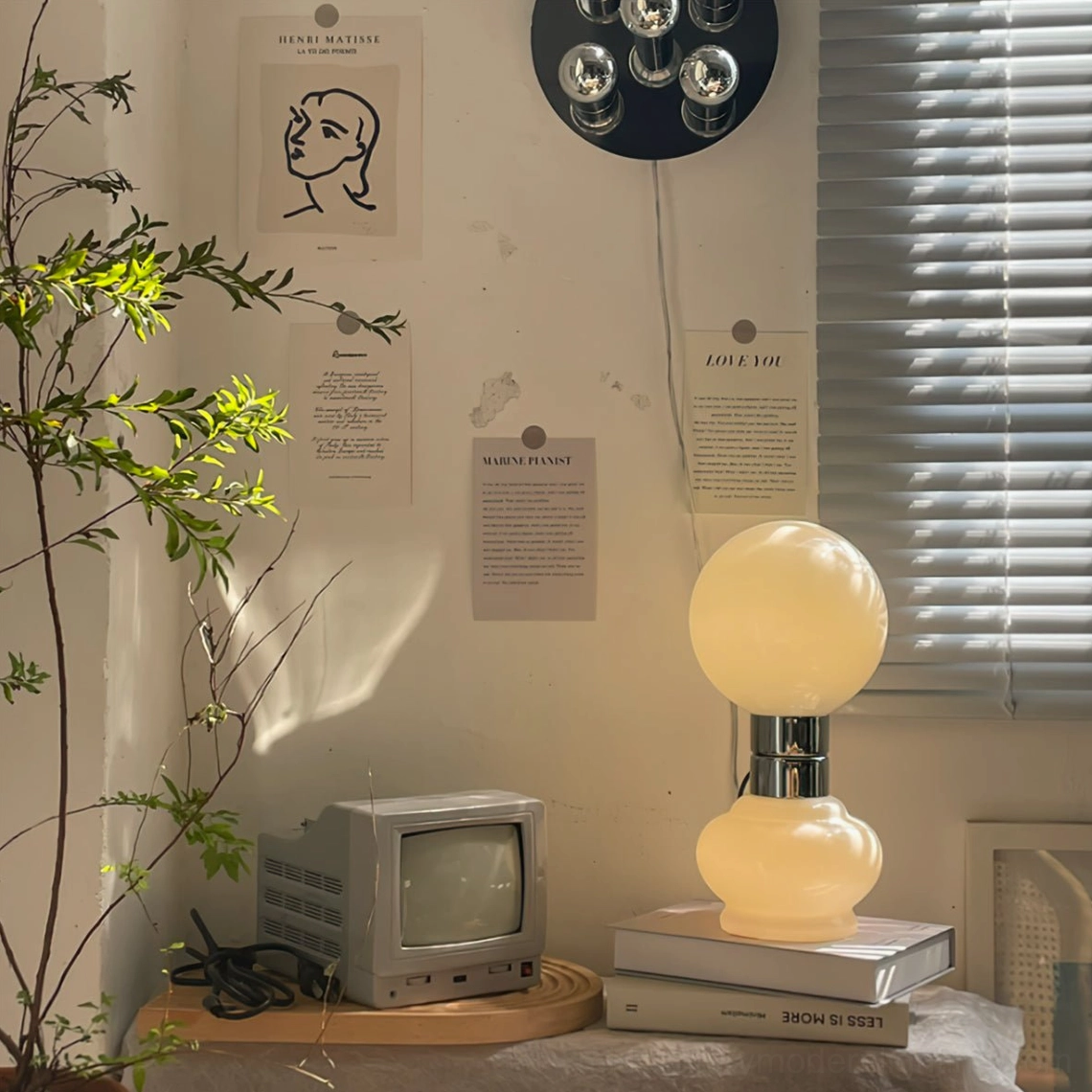 Birillo table lamp lit three-quarter view retro home vintage TV posters warm ambiance