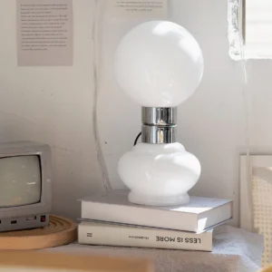 Birillo table lamp styled in vintage home interior with retro television and books
