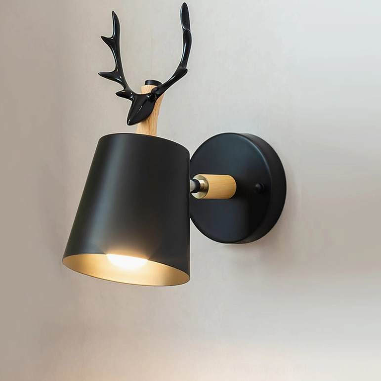 Black matte antler wall lamp with wall switch installation, front view on neutral background, Scandinavian design