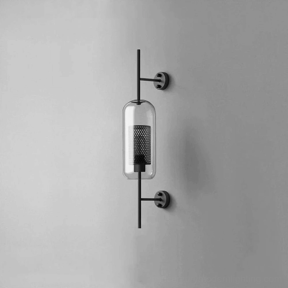 Glass wall sconce with black metal finish and clear honeycomb glass shade