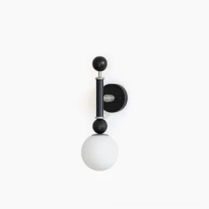 Sculptural globe wall sconce with matte black frame and frosted glass shade on white background, front studio view