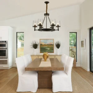 Black Kelleher chandelier installed in modern minimalist white dining room