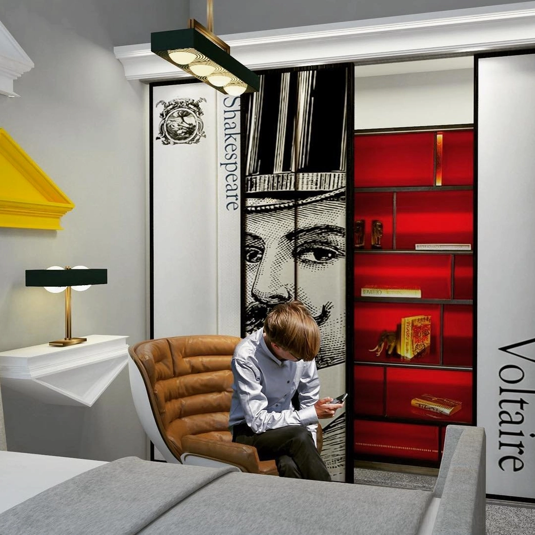 Black Kernel table lamp with brass gold stand in modern lounge study space with wall murals