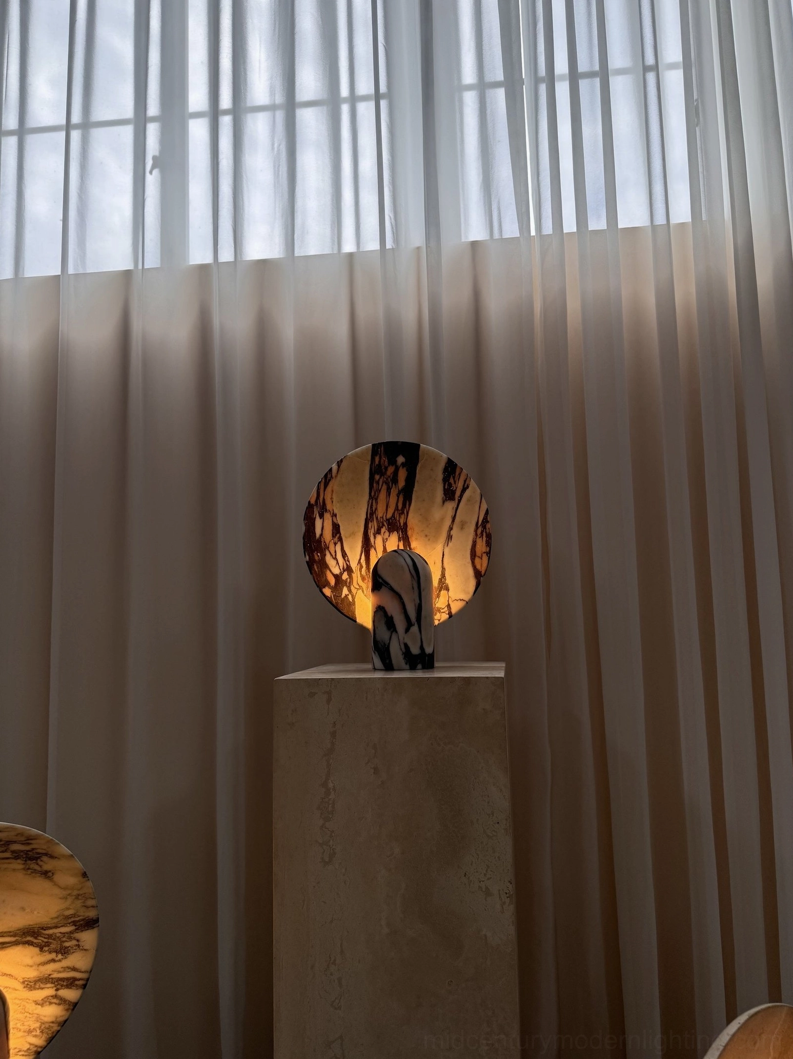 Black marble table lamp variant with white veining detail on minimalist display showing dramatic color contrast and visual sophistication