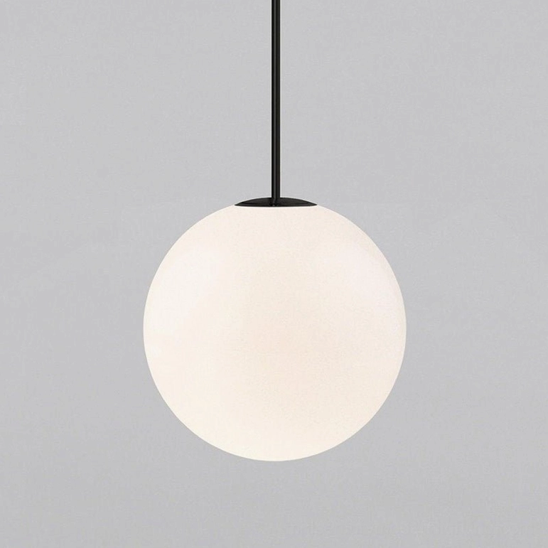 Black matte finish brass globe pendant light in contemporary minimalist home decor