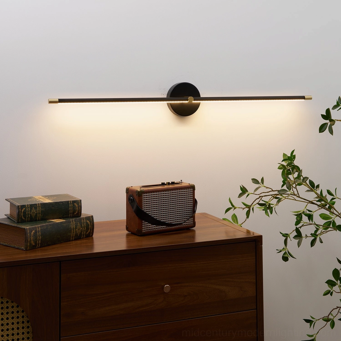 Slim matte black wall-mounted linear lamp with clean geometric form