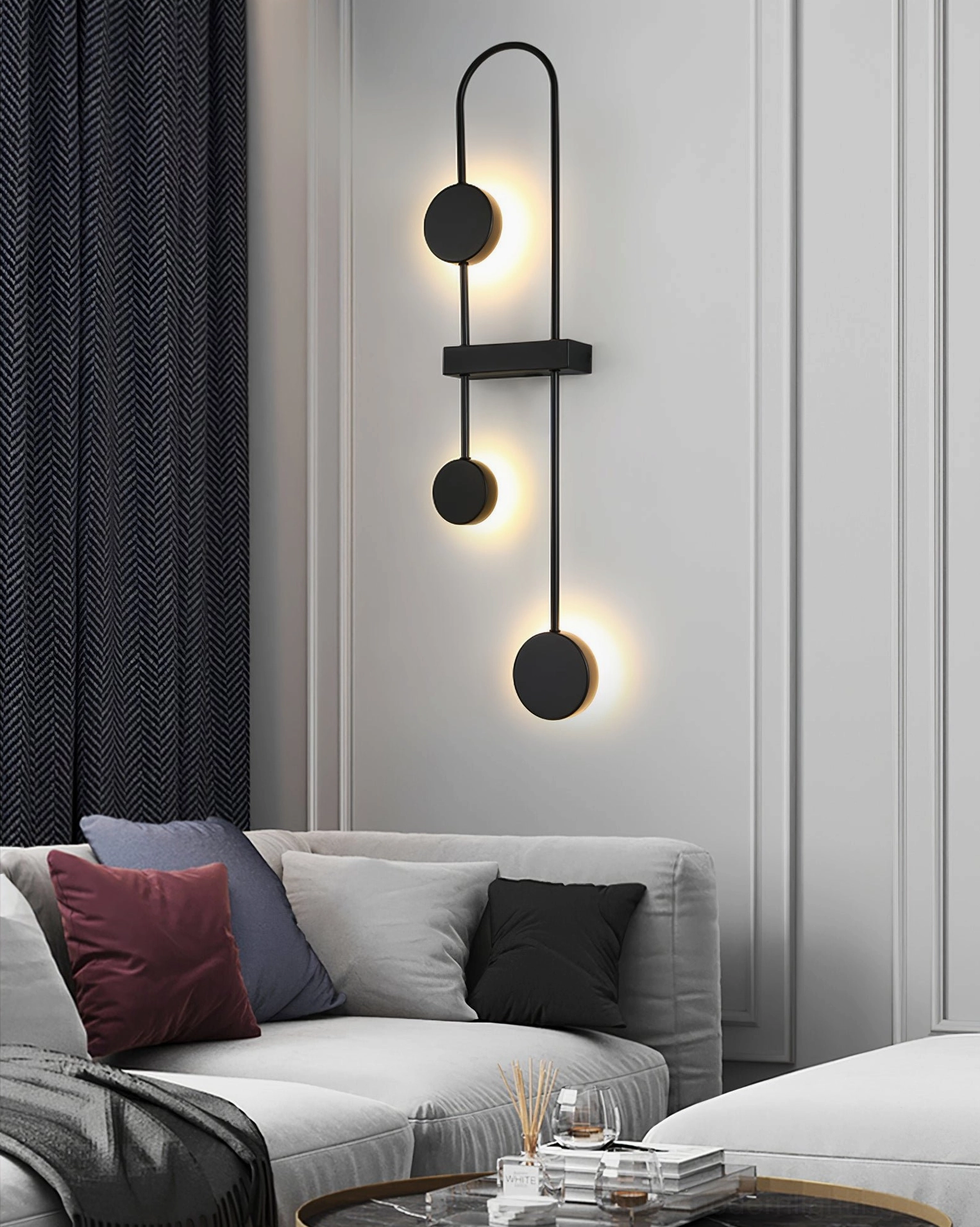 Matte black molecular wall lamp with geometric glass pendant in modern interior setting