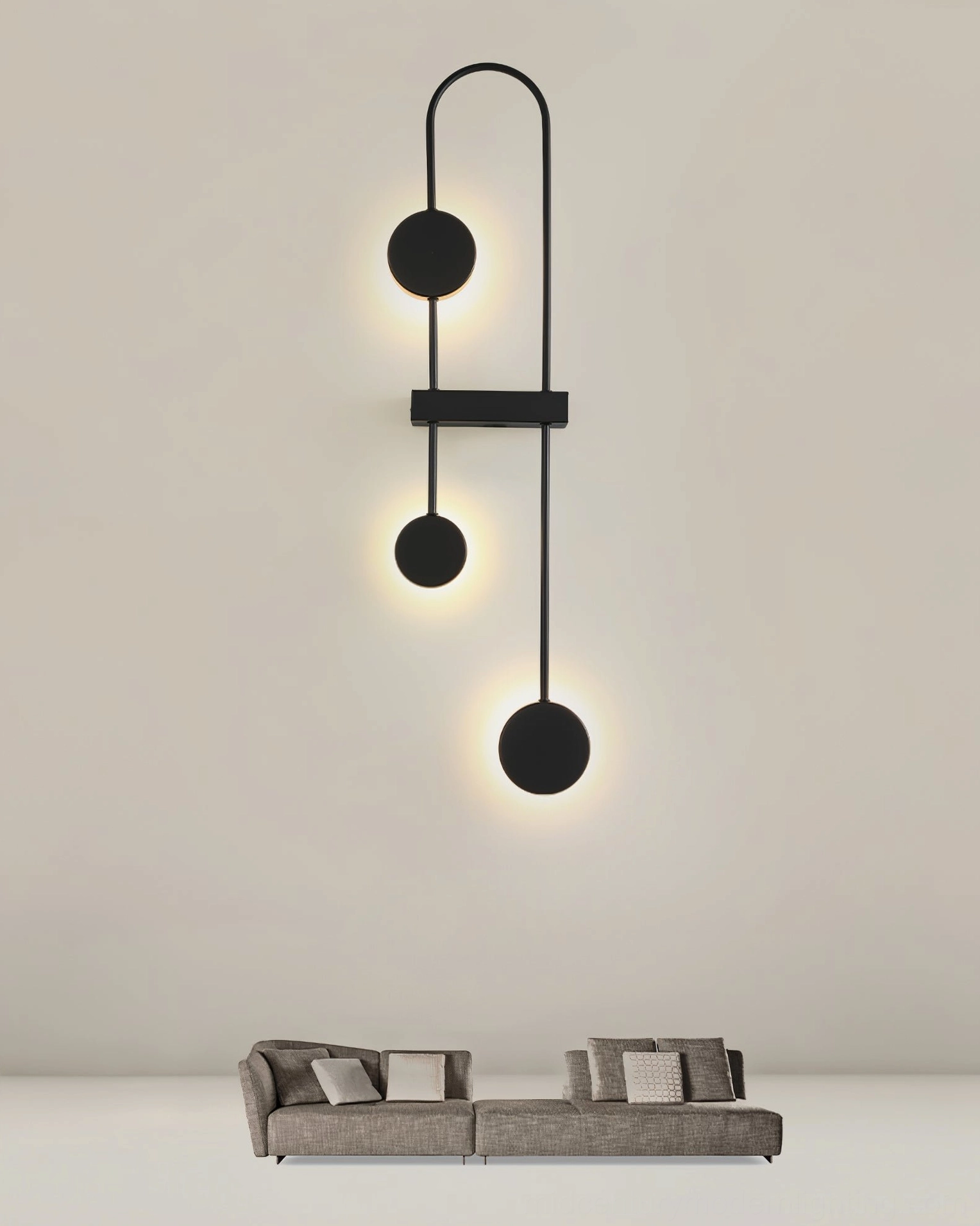 Matte black vertical geometric wall lamp with warm LED accent lighting in contemporary minimalist room