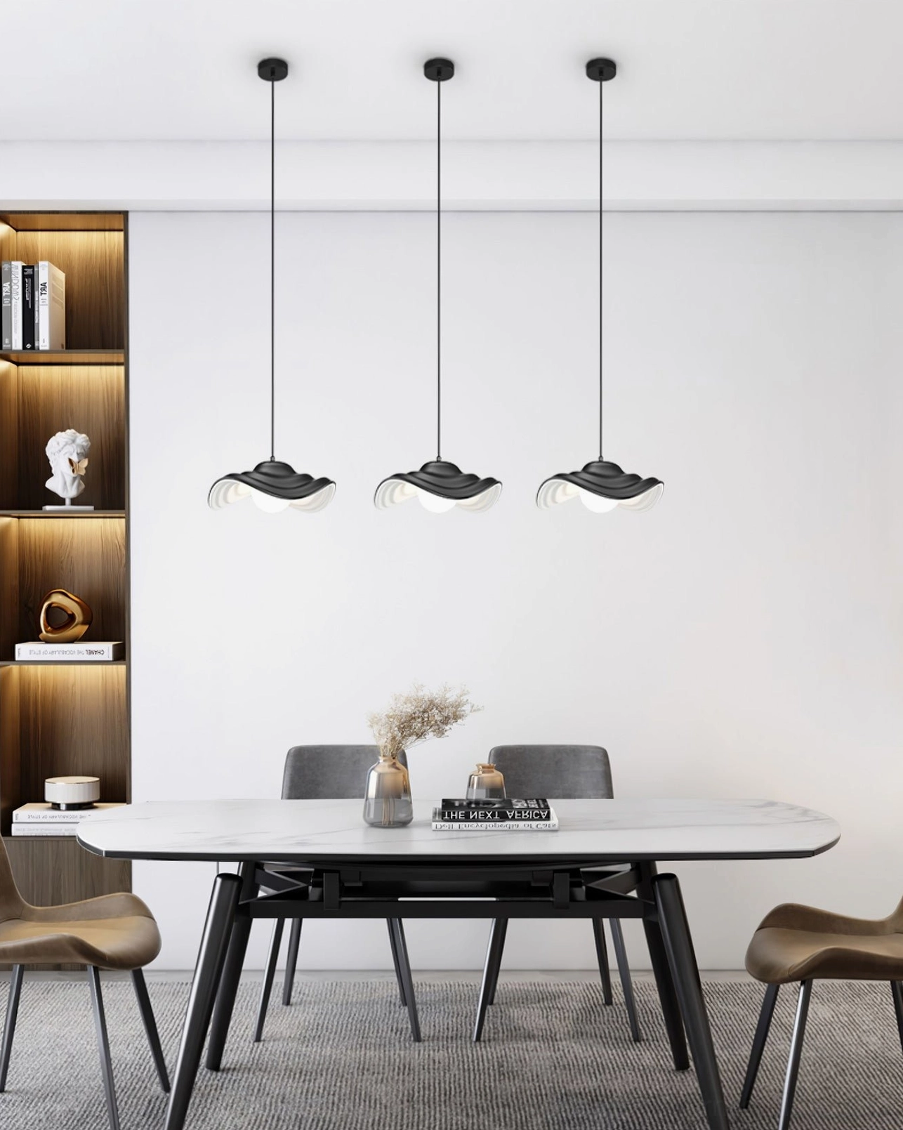 Set of three matte black wavy pendant lamps coordinated above modern dining table, creating minimalist sculptural lighting installation