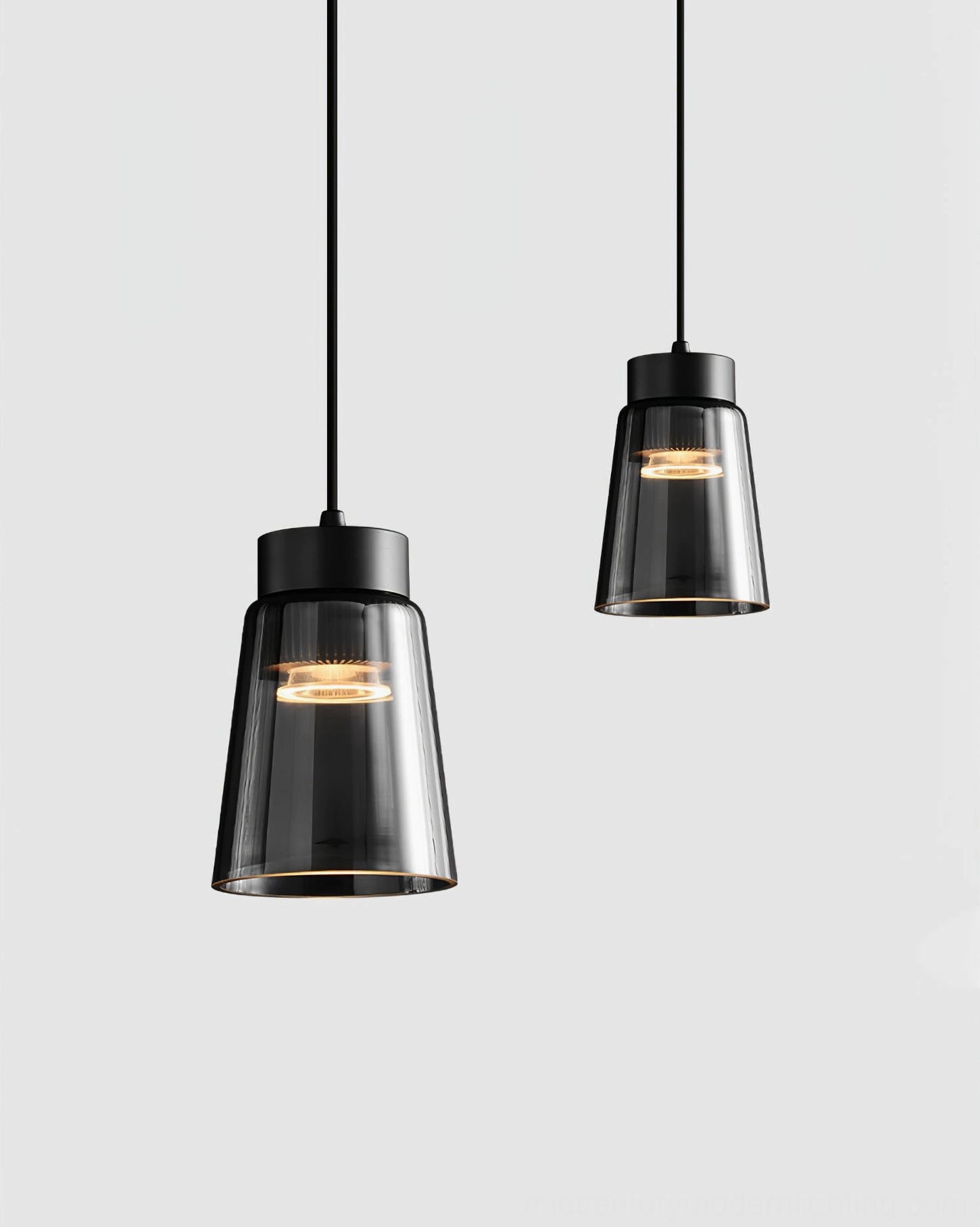 Contemporary black and smoke grey cone pendant lamp creating focused ambient light