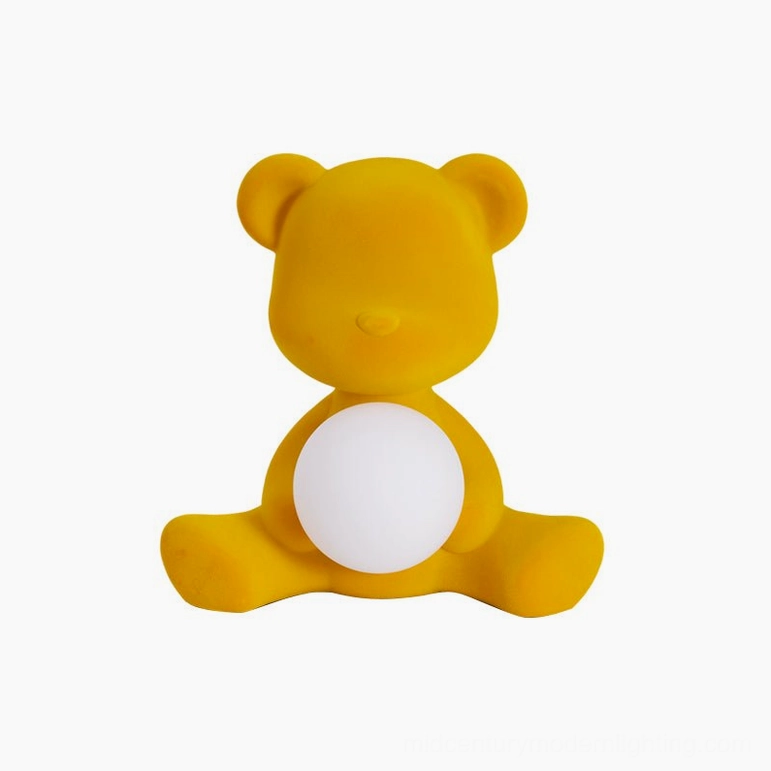Black flocked teddy table lamp on glass top desk with bright cool white light