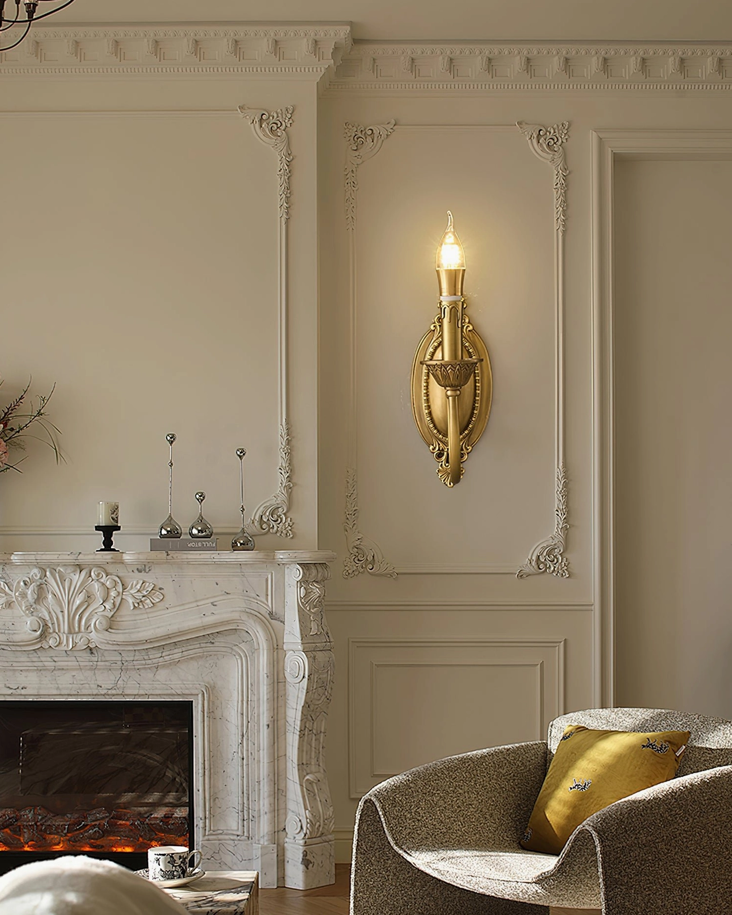 Blair brass candle sconce installed in residential bedroom corner creating elegant wall lighting