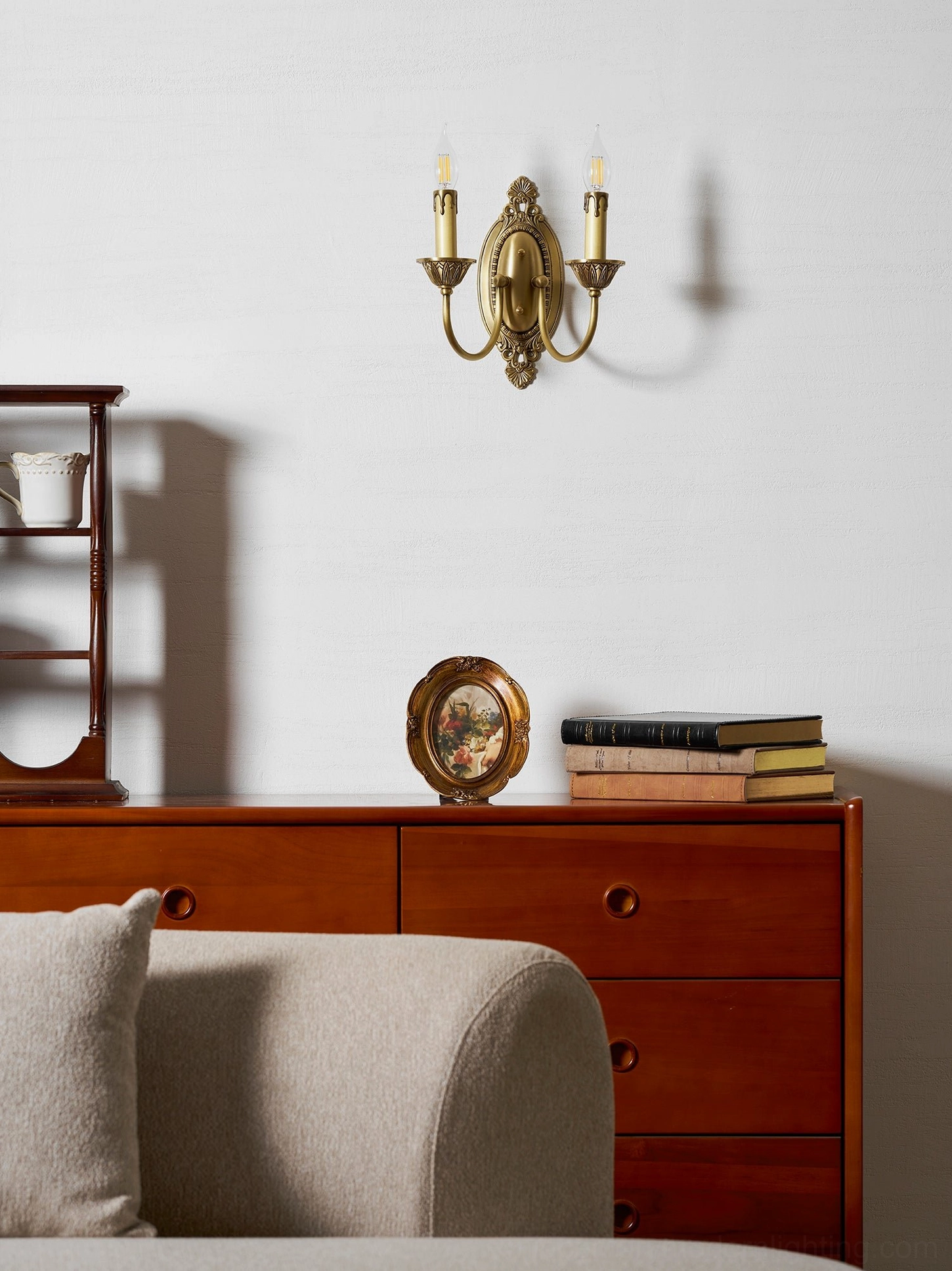 Blair brass candle sconce with E14 bulb base compatibility shown in studio lighting setup