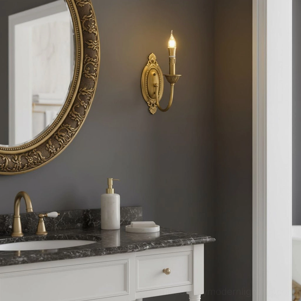 Blair brass candle wall light mounted in hallway showing elegant hand-finished brass surface