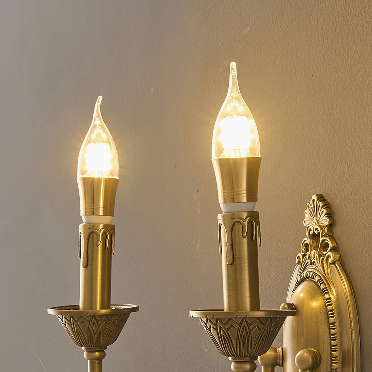 Blair brass candle wall sconce installation detail showing mounting bracket and electrical connection