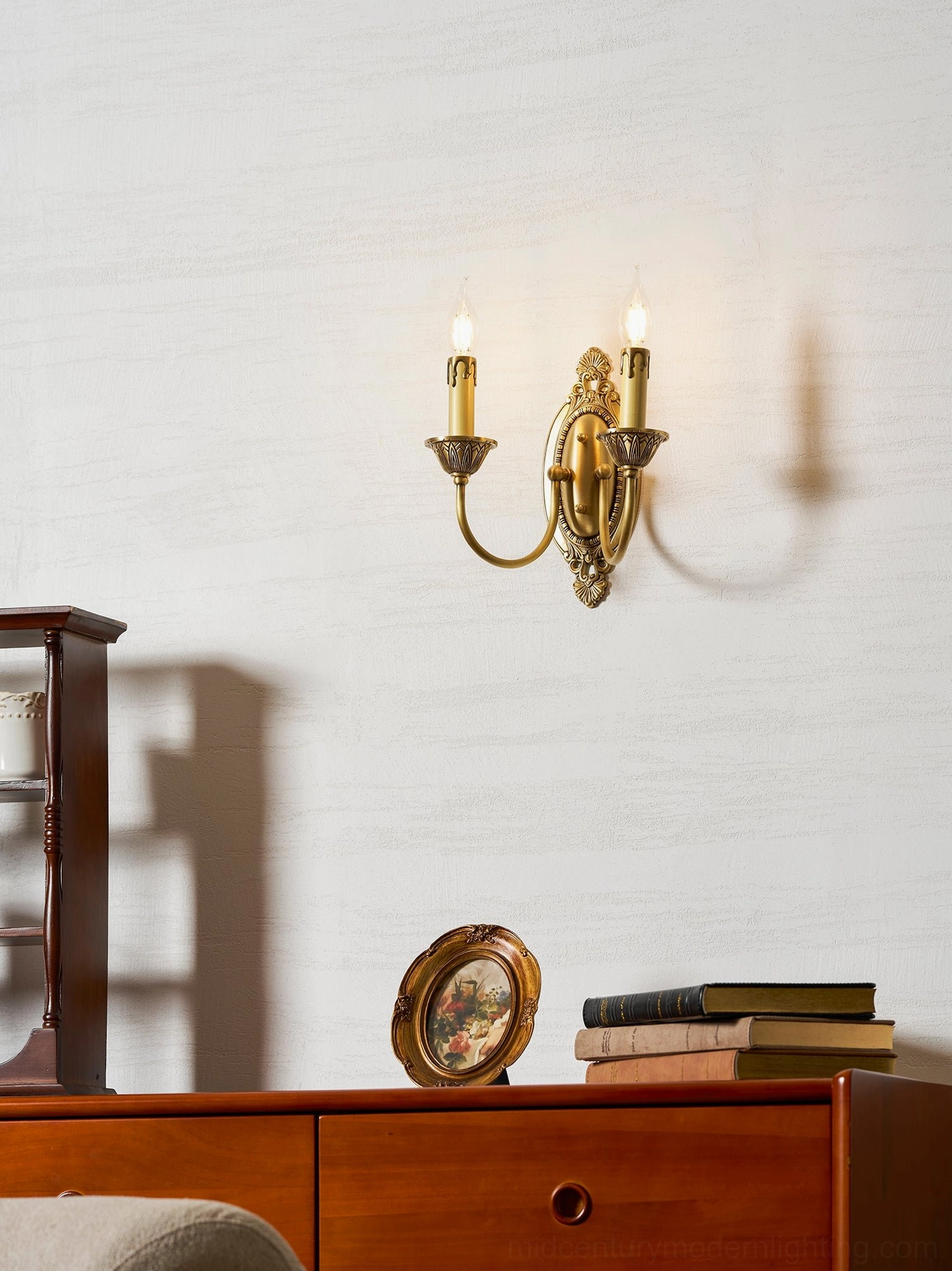 Blair brass candle sconce installation showing electrical hardwire connection and wall mount detail