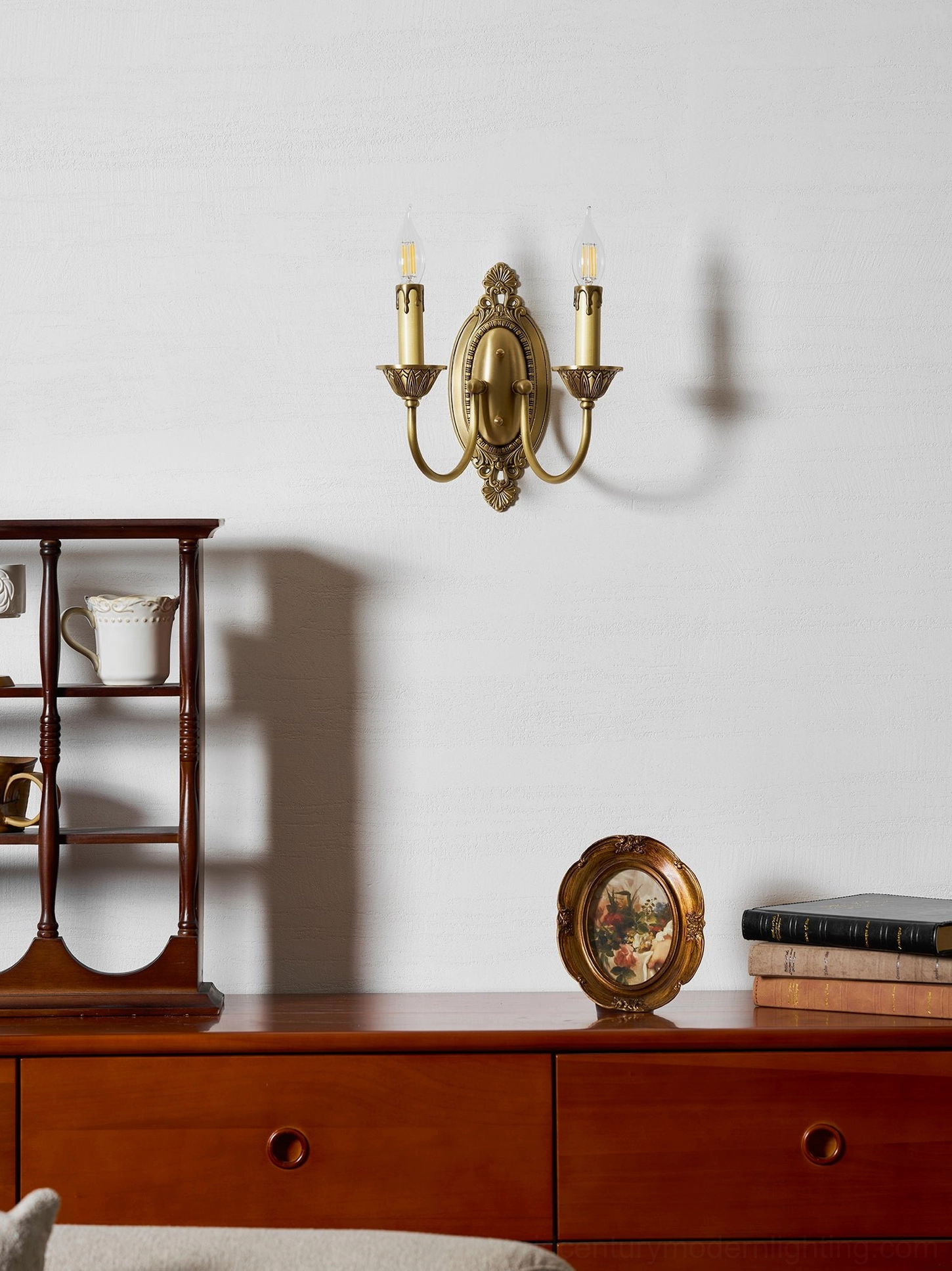 Pair of Blair brass candle wall sconces symmetrically installed in traditional home design