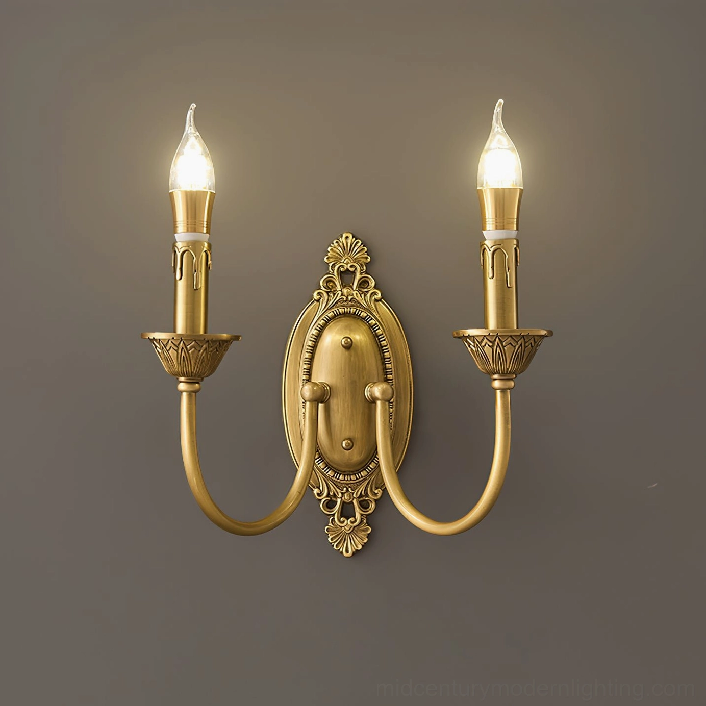 Wide variant Blair brass candle wall sconce measuring 11.8 inches length in warm brass finish