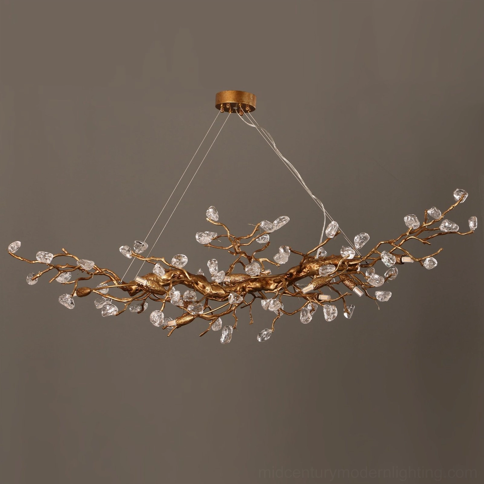Close-up detail of Bloom Branch Chandelier brass twig structure with sparkling crystal decorative elements