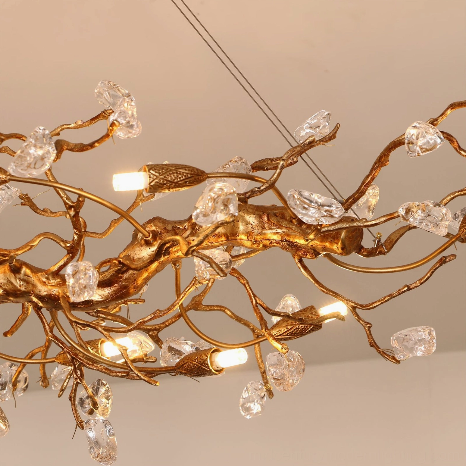 Bloom Branch Chandelier illuminated installation in dining space showing warm ambient light distribution