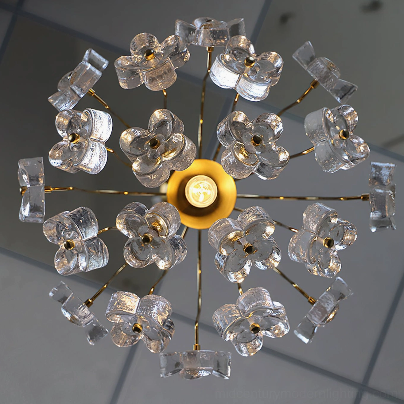 Blossom pendant chandelier showcasing transparent glass flower clusters with golden metal framework detail