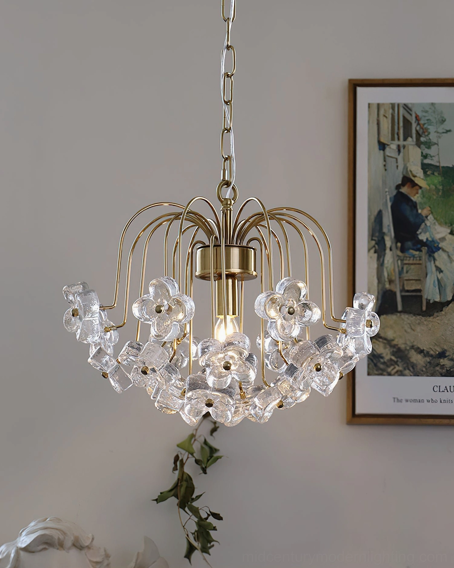 Glowing Blossom pendant light casting warm illumination in vintage interior with framed artwork and elegant décor