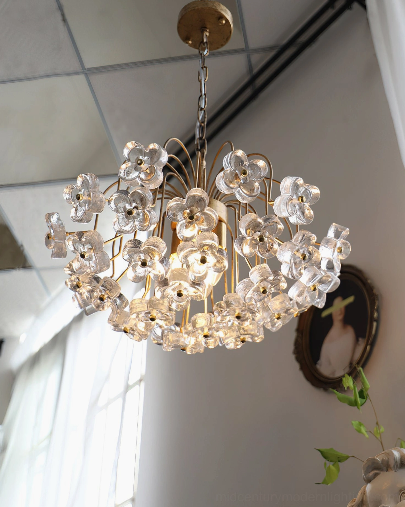 Overhead view of Blossom crystal flower pendant showing full radial arrangement of glass flowers in industrial studio