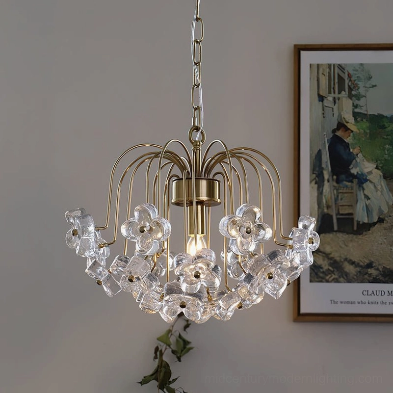 Blossom crystal flower pendant light available in two sizes with golden metal frame and transparent glass design