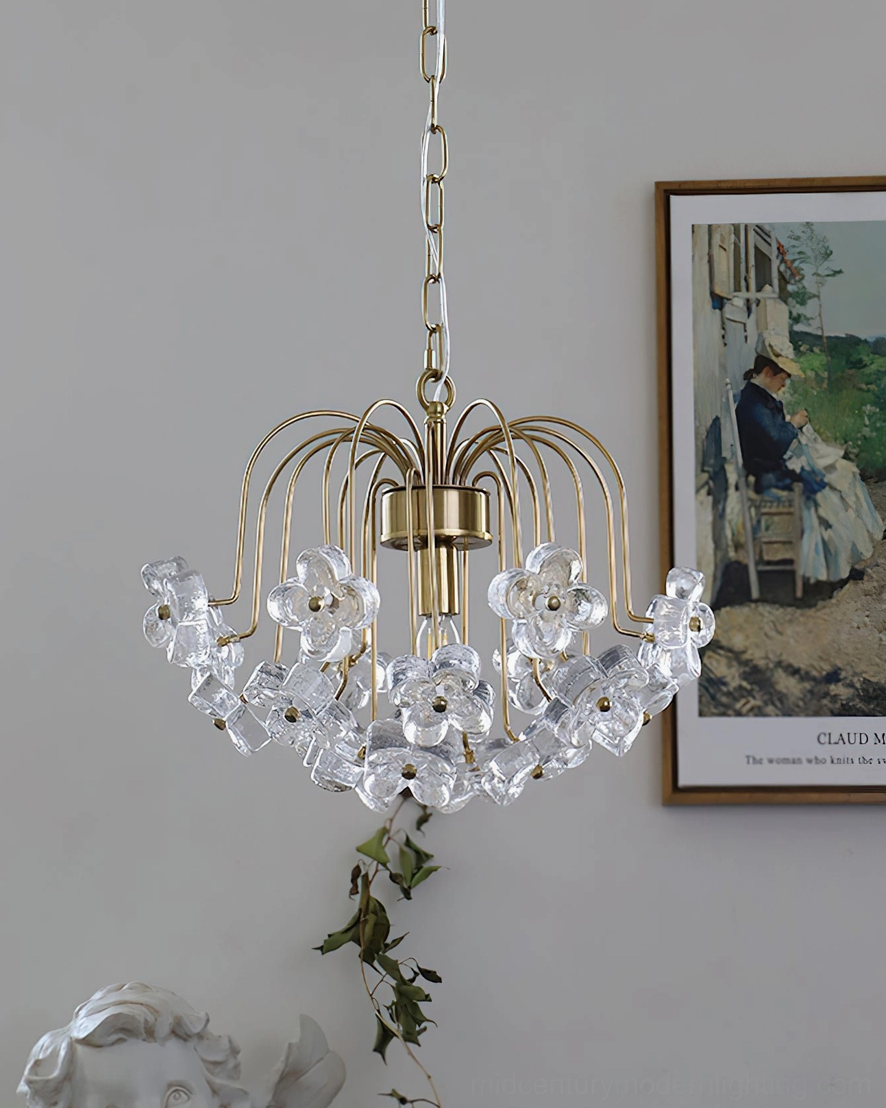 Unlit Blossom crystal flower pendant in vintage home scene with green plants and framed wall art