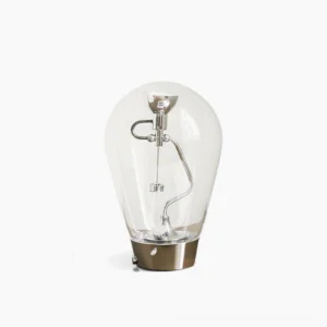 Blow clear glass table lamp front view with polished chrome base on white background - modern integrated LED desk light