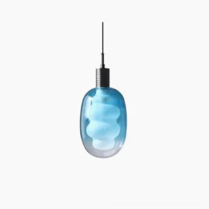 Gradient blue sculptural glass pendant light with frosted cloud-shaped shade and brass metal top, studio front view