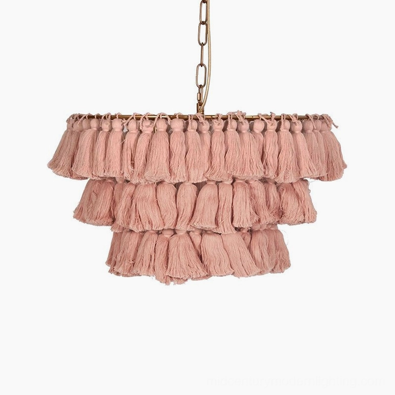 Blush pink bohemian tassel chandelier with delicate layered fabric construction detail