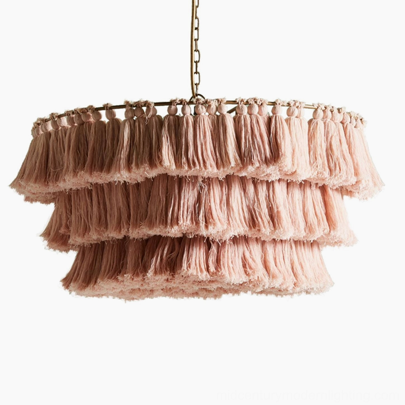 Blush pink handcrafted tassel pendant light on white background showcasing romantic bohemian design