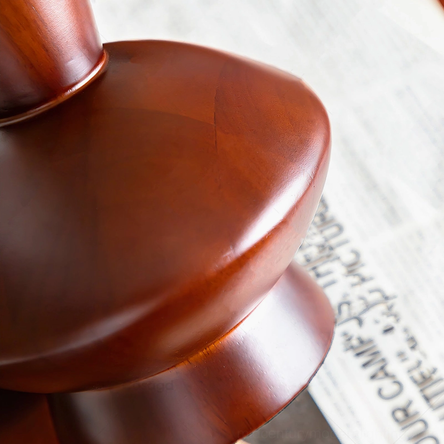 Close-up detail of dark walnut wood base and pole of Bobbin table lamp showing natural grain texture