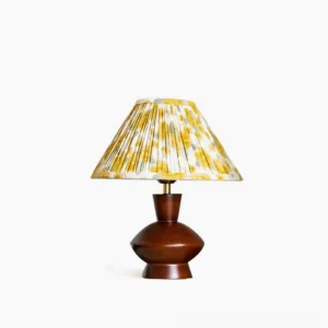 Bobbin mid-century modern table lamp with pleated fabric shade and dark walnut wood base, front studio view