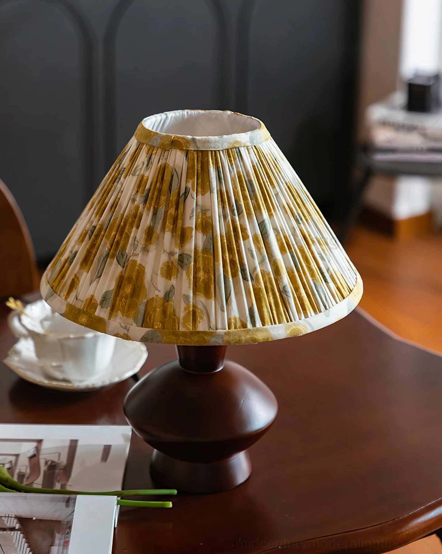 Bobbin mid-century modern table lamp with teacup props on wooden table, vintage studio product shot