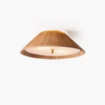 Bodie rattan ceiling flush mount light fixture front overhead view with warm woven texture