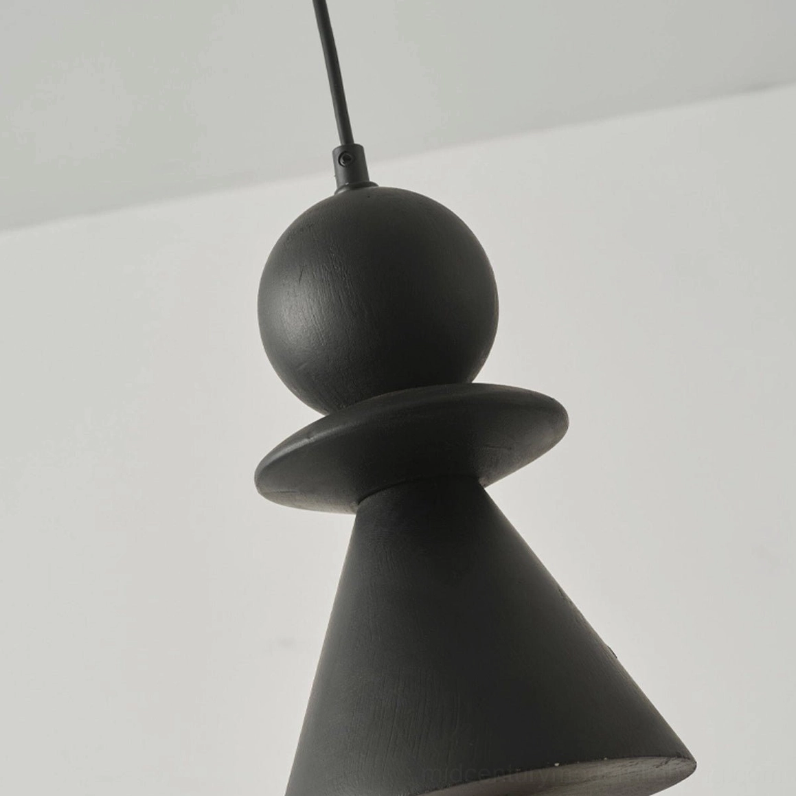 Bodie sculptural wood totem pendant light design detail view from alternate angle showing hand-carved stacked wooden elements