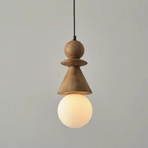 Illuminated Bodie stacked wood totem pendant light showing warm LED glow against neutral wall background, close-up detail view