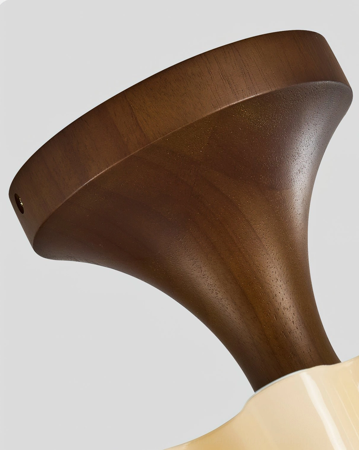 Bofea ceiling lamp mounting base close-up showing curved tapered walnut wood finish detail