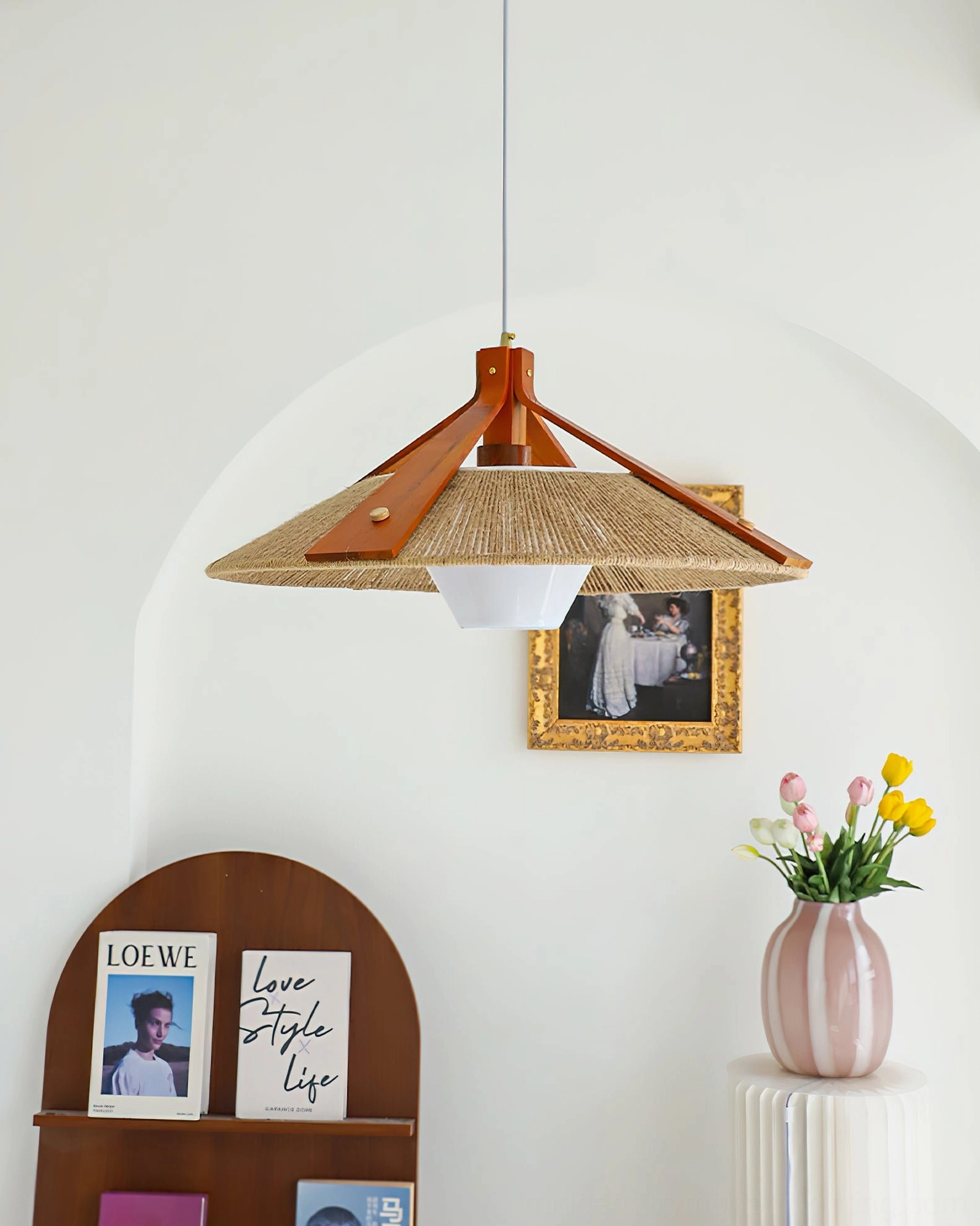 Retro bohemian pendant lamp with wood frame and metal fasteners displayed beside decorative flower vase and arched shelf styling