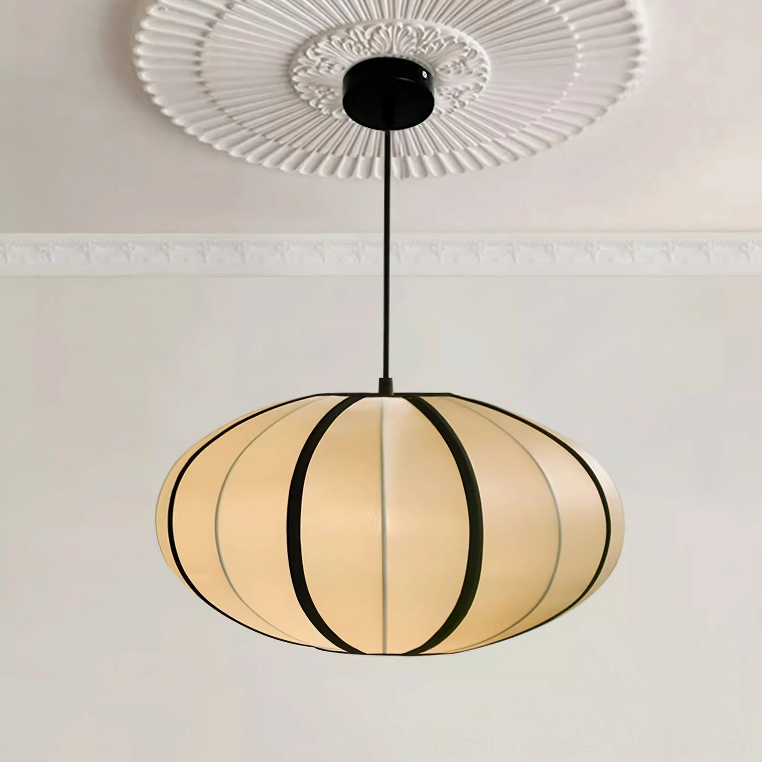 Bombori pendant light installation above dining table, ambient room view