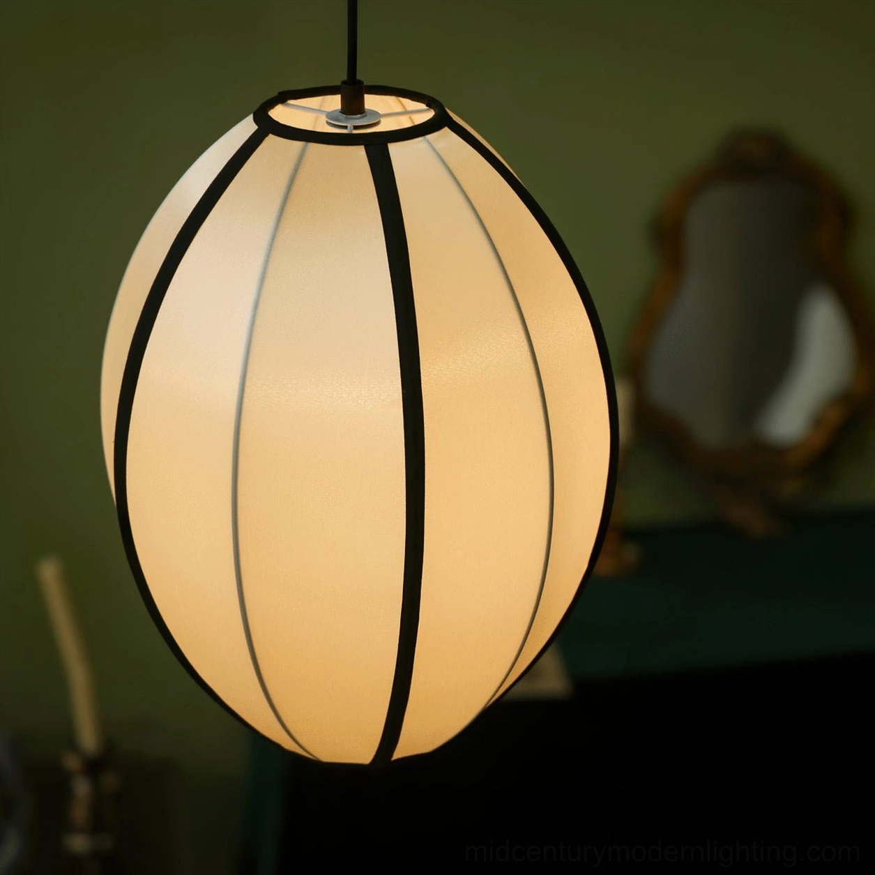 Bombori fabric pendant light showing warm glow through translucent shade