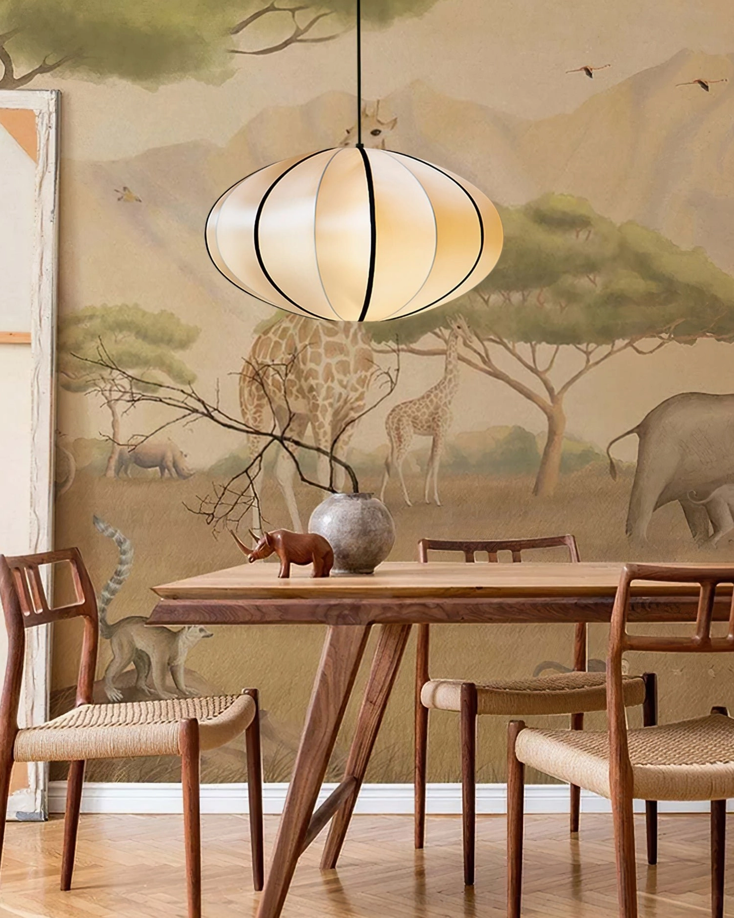 Bombori pendant light over wooden dining table in safari-themed dining space
