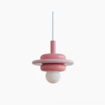 Bomiello space age pendant light front view with glossy pink layered disc design on white background