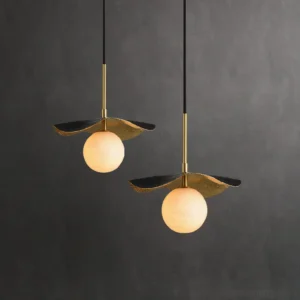 Pair of Bonnie alabaster pendant lights hung symmetrically, showcasing dual fixture setup in modern interior with grey wall backdrop