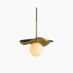 Bonnie alabaster pendant light with hand-textured brass canopy and glowing natural stone sphere, front view against white studio background